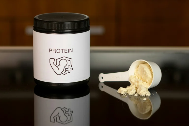 Container of protein powder with a scoop, illustrating high-protein nutrition for maintaining and building muscle, as advised by a CORU registered Galway dietitian.
